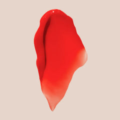 Summer Fridays Lip Butter Balm Poppy close-up on lips showing coral tint and shine