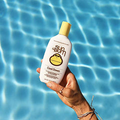 Sun Bum lotion being applied to sun-kissed skin for instant relief