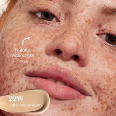 Fingers applying Supergoop Protec(tint) for easy blend on skin