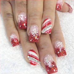 Sutaozhi Christmas press-on nails with snowflake rhinestones for a festive manicure.