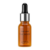 Tan-Luxe The Body Illuminating Self-Tan Drops bottle close-up for customizable, natural glow.