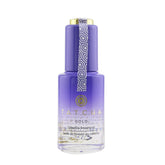 TATCHA Gold Camellia Beauty Oil bottle close-up with 23k gold flakes for radiant glow.