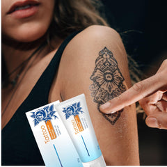 Applying Tattoo Aftercare Ointment on tattooed skin to soothe irritation