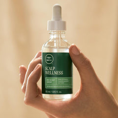 Tea Tree Scalp Wellness Serum application on scalp shows quick absorption.