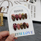 TENPAL Burgundy cat-eye nails close-up showcases rich color and embossed texture.