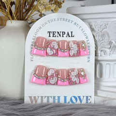 TENPAL duckbill nails with elegant French tip and gems for chic looks.