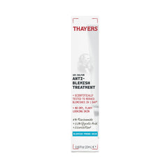 Applying THAYERS Rapid Acne Treatment to a blemish for targeted spot care.