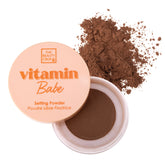 The Beauty Crop Vitamin Babe Setting Powder packaging with puff for quick touch-ups.