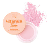 The Beauty Crop Vitamin Babe pink setting powder with puff for on-the-go touch-ups.