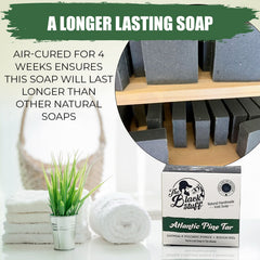 The Black Stuff Pine Tar Soap bar close-up, exfoliating pumice ready to slough away dull skin.
