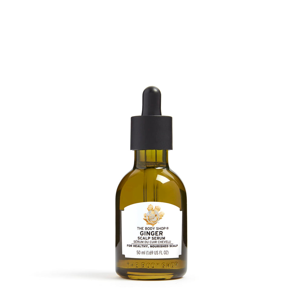 The Body Shop Ginger Scalp Serum bottle close-up for nourishing scalp care