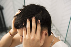 The Body Shop Ginger Scalp Serum being massaged into the scalp