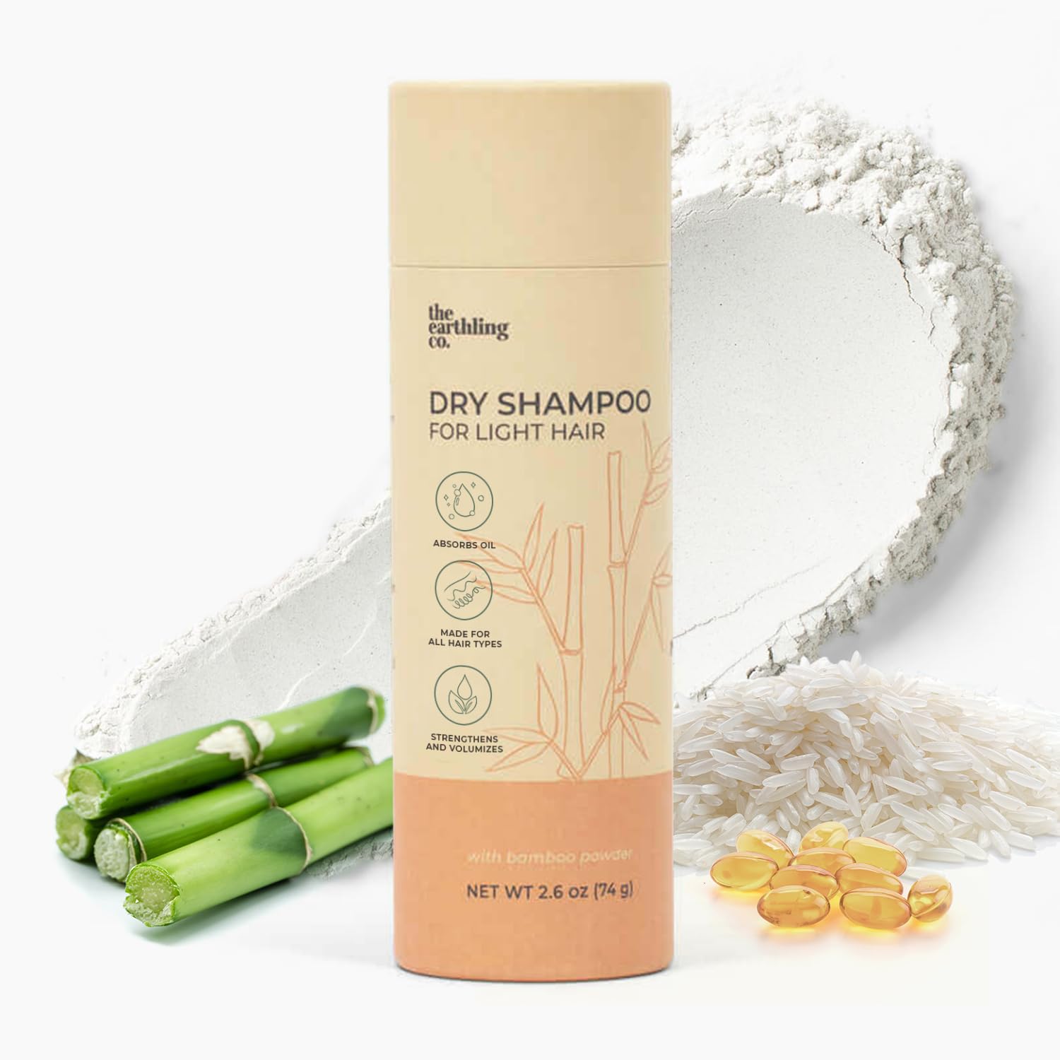 The Earthling Co. dry shampoo bottle refreshing oily roots with a clean, lightweight boost.