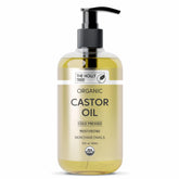 The Holly Tree Organic Castor Oil bottle pour showing pure, versatile oil for skin and hair