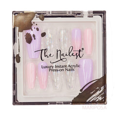 The Nailest Mariposa press-on nails in medium coffin shape during application scene for quick at home wear