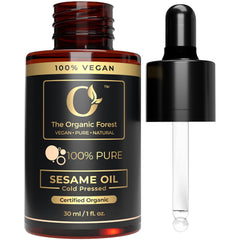 The Organic Forest sesame oil bottle, cold-pressed purity for skin care.
