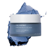 The Outset Purifying Blue Clay Mask jar close-up, fragrance-free detox for sensitive skin.