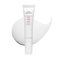 The Untamed Superluminal Dawn Eye Serum bottle close-up for brightening and hydration.