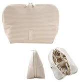 The Verti vertical waterproof makeup bag showcasing its 23-pocket layout for quick access.