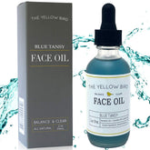 The Yellow Bird Balancing Blue Tansy Oil bottle pour promotes radiant, nourished skin.