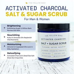 The Yellow Bird charcoal scrub texture being scooped for face and body exfoliation.