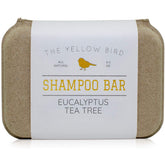 The Yellow Bird eucalyptus tea tree shampoo bar packaging showcases zero-waste design.