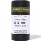 The Yellow Bird natural deodorant with activated charcoal bottle for all-day odor control.