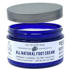 The Yellow Bird Tea Tree Foot Cream bottle provides deep hydration for dry feet.