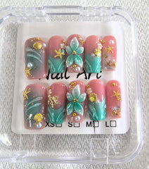 Threelegscat nails with sparkling rhinestones add luxe sparkle for celebrations.