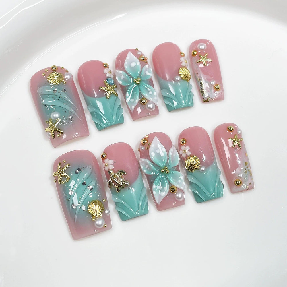Threelegscat square nails with 3D flower design for a festive manicure.