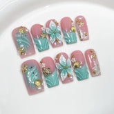 Threelegscat square nails with 3D flower design for a festive manicure.