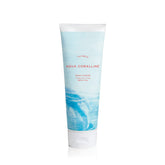 Thymes Aqua Coralline bottle pour detail, showcasing hydrating formula.