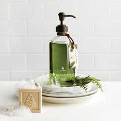 Thymes Frasier Fir bottle by sink creates inviting, woodsy ambiance