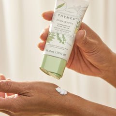 Thymes bottle label closeup communicates cruelty-free and paraben-free formulation.