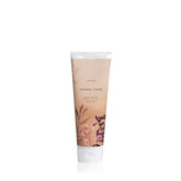 Thymes Sienna Sage Body Scrub bottle showcases moisturizing exfoliation.