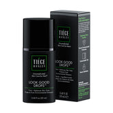 Tiege Hanley Look Good Drops bottle pour shows a buildable tint for a natural glow.