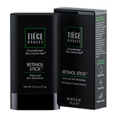 Tiege Hanley Retinol Stick on forehead for smoother texture and hydration.