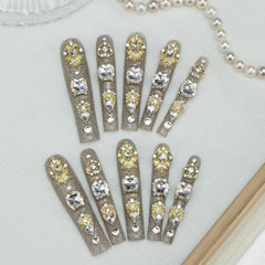 Tmani 10pc nails in diamond-glitter long square style for bold looks.