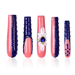 Tmani extra-long nails in a purple case are ready for a glamorous manicure.