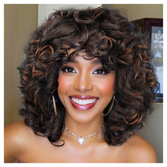 Traqur Curly Wig in soft honey blonde with face-framing bangs for everyday wear