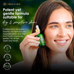 Application scene with fingertips applying Tree of Life Niacinamide Serum on sensitive skin.