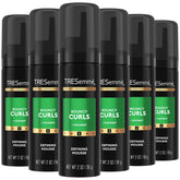 TRESemmé Defining Hair Mousse bottle for bouncy curls and lasting definition.
