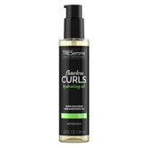 TRESemmé Flawless Curls Hydrating Oil bottle for defined, frizz-free curls