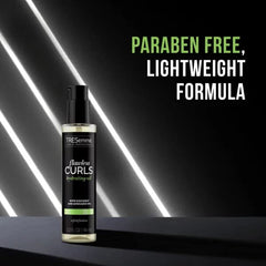 TRESemmé Flawless Curls Hydrating Oil in hair for frizz control and shine