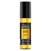 TRESemmé Lamellar Gloss Oil bottle front for instant glossy shine and sleek look.