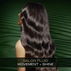TRESemmé Pro Infusion Fluid Volume Conditioner with plant-based protein for deep fiber care.