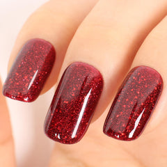 TUTUYU red glitter gel polish bottle with festive poinsettia shine.