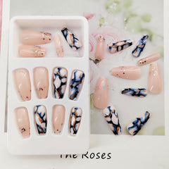 TUZANDW medium-length nails close-up showing durable, comfortable wear.