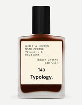 Typology tinted lip oil Black Cherry bottle with nourishing glossy color.