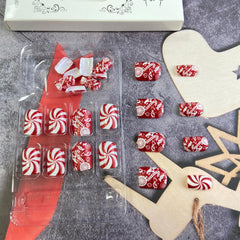 Tyuimhx close-up red glitter tips for festive glamour.